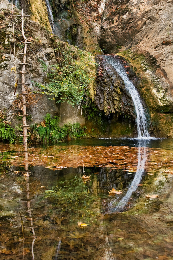 A gorgeous set of waterfalls nestled among perennial plane trees